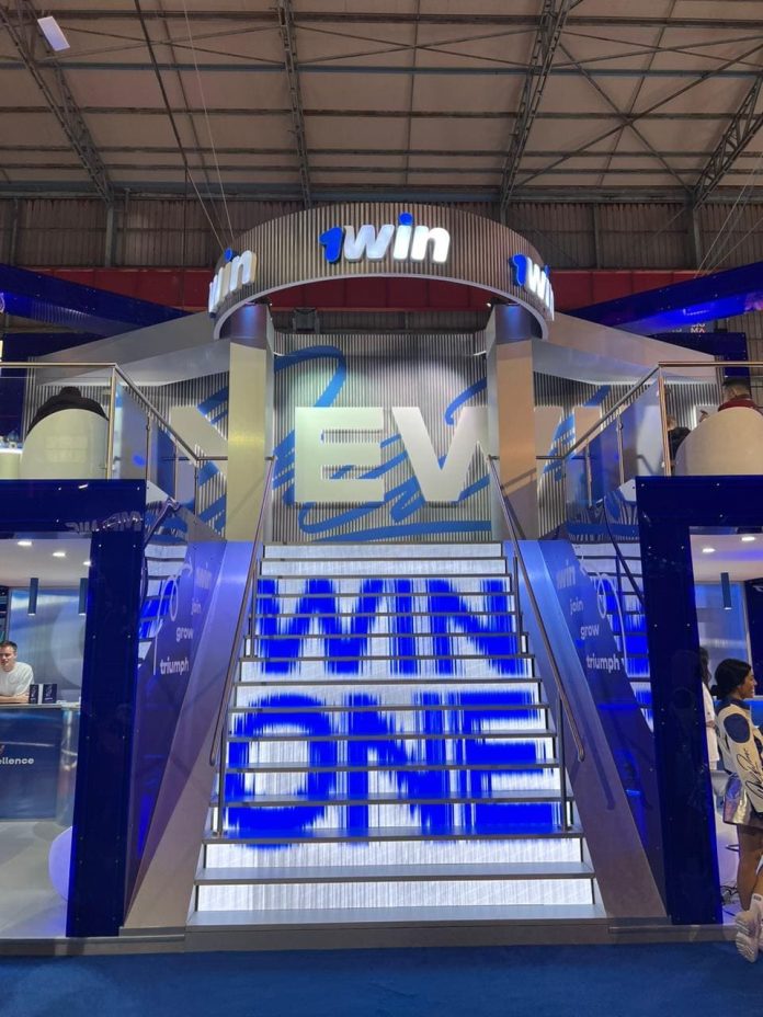 Área totalmente personalizada da 1Win na convenção